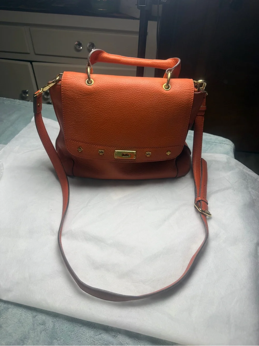 Structured Orange Leather Satchel with Top Handle and Crossbody Strap